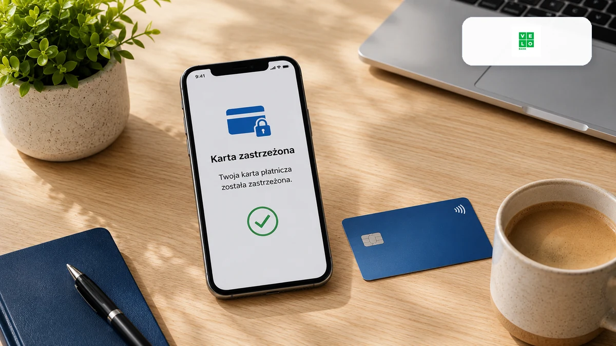 Telefon z potwierdzeniem zabezpieczenia karty i logo VeloBank na biurku